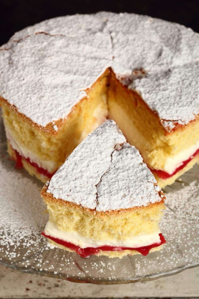 Close-up of Victoria sponge cake slices on a plate.