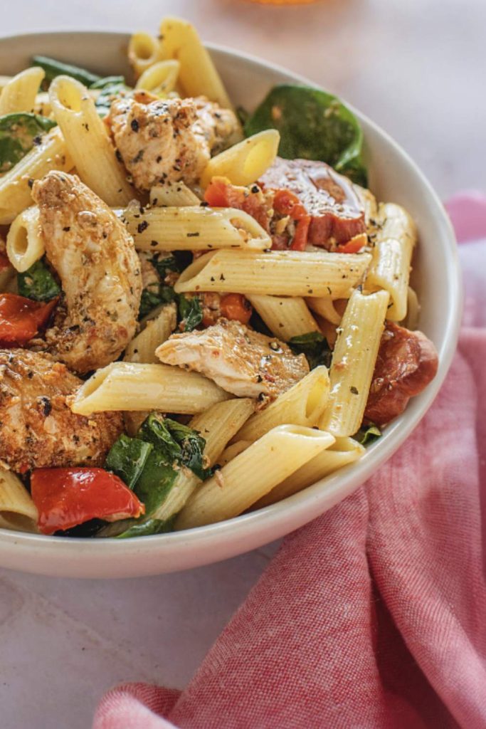 Close-up of slow cooker chicken and chorizo pasta in a bowl.