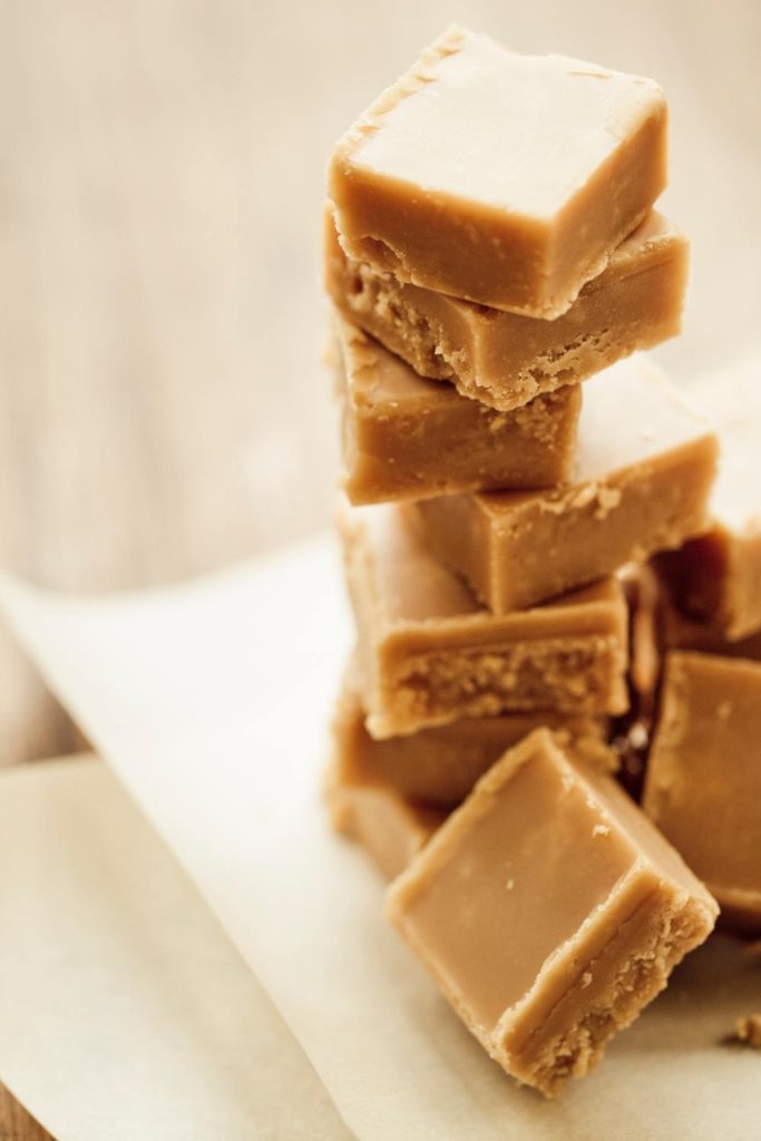 Cut squares of Bailey's fudge on baking paper.