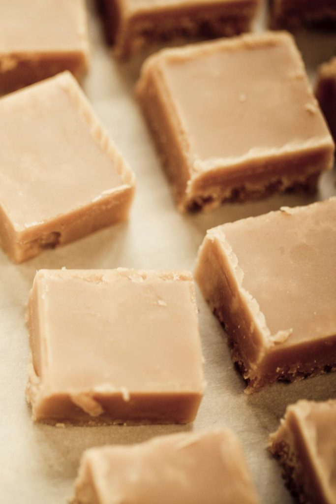 Stack of Baileys fudge on a plain background.