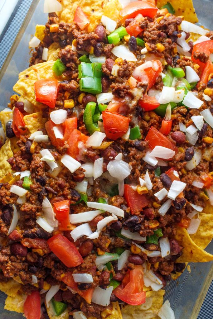 Slow Cooker Beef Nachos in a glass dish.