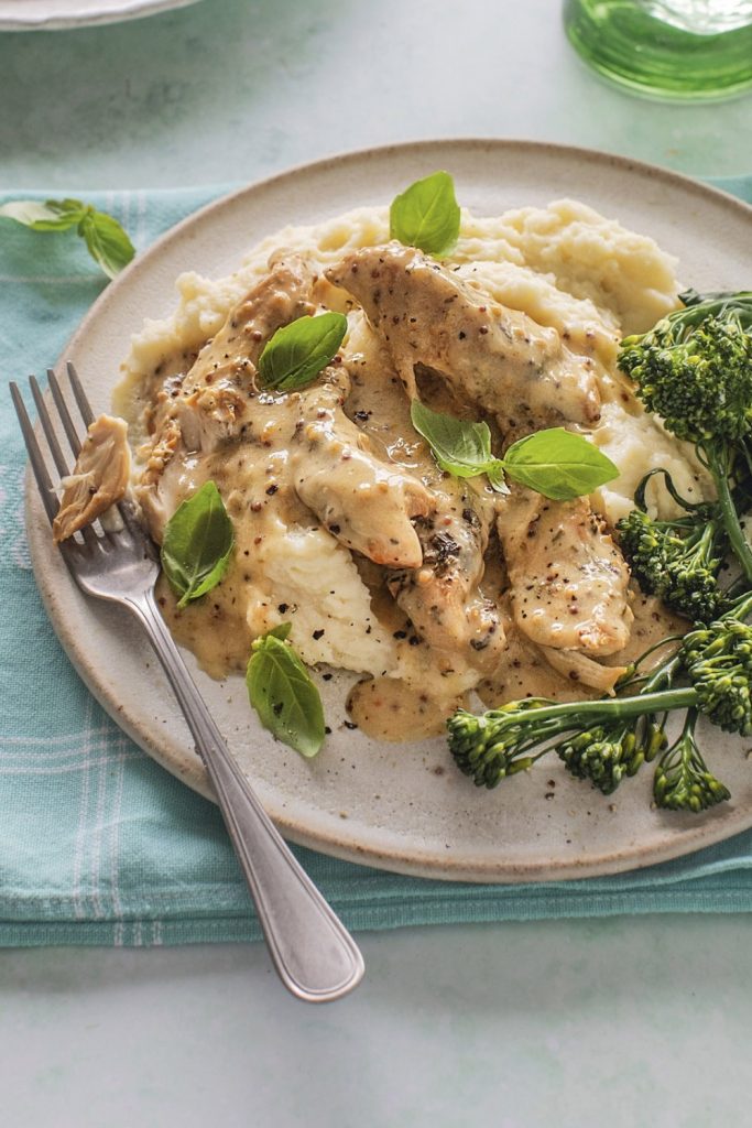 Honey Mustard Chicken with sides of mashed potatoes and broccolini.