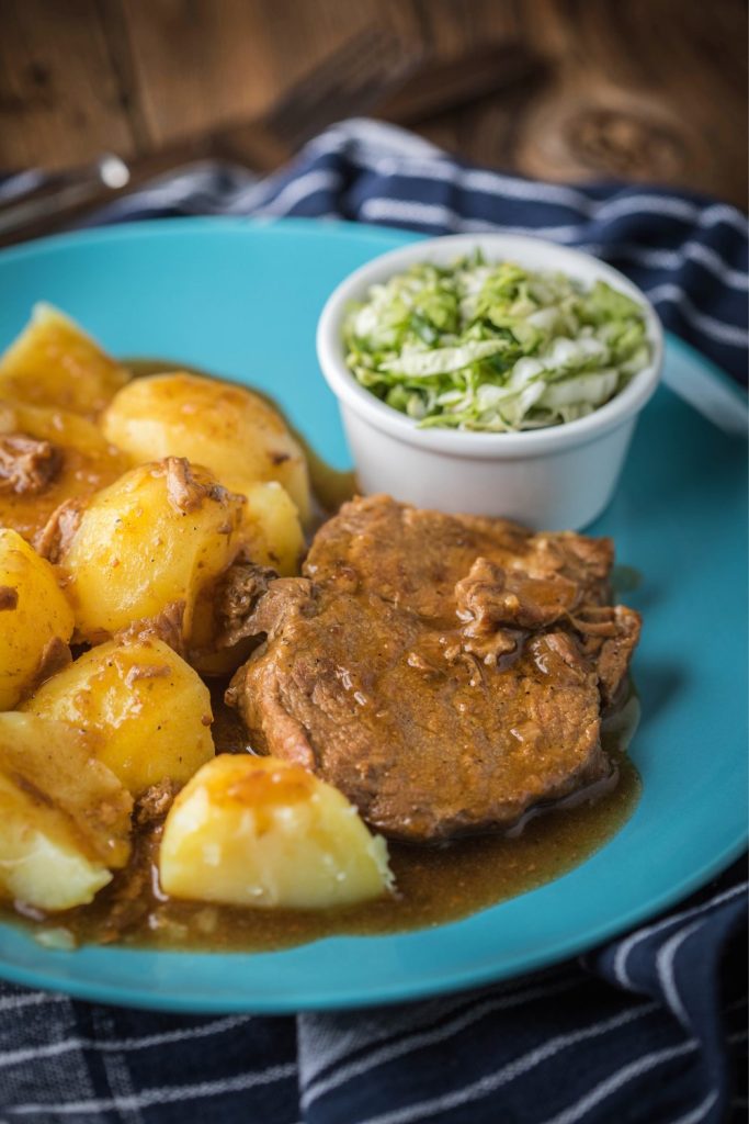 Slow Cooker Nanny’s Braised Steak served with boiled potatoes.
