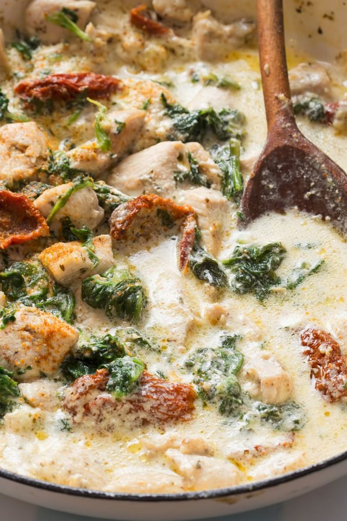 Slow Cooker Chicken Heaven with creamy spinach sauce.