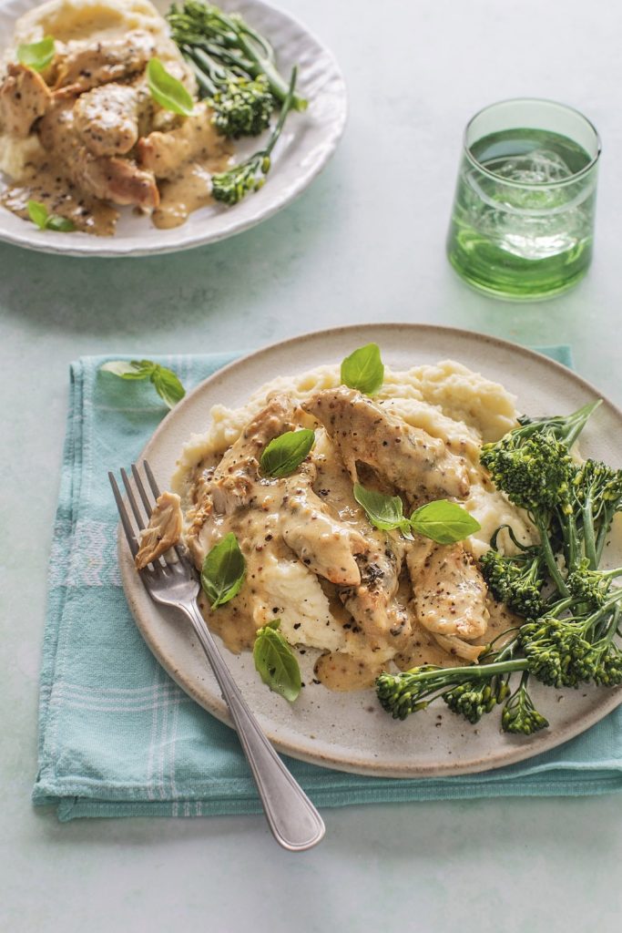 Slow Cooker Honey Mustard Chicken served with mashed potatoes and broccolini.