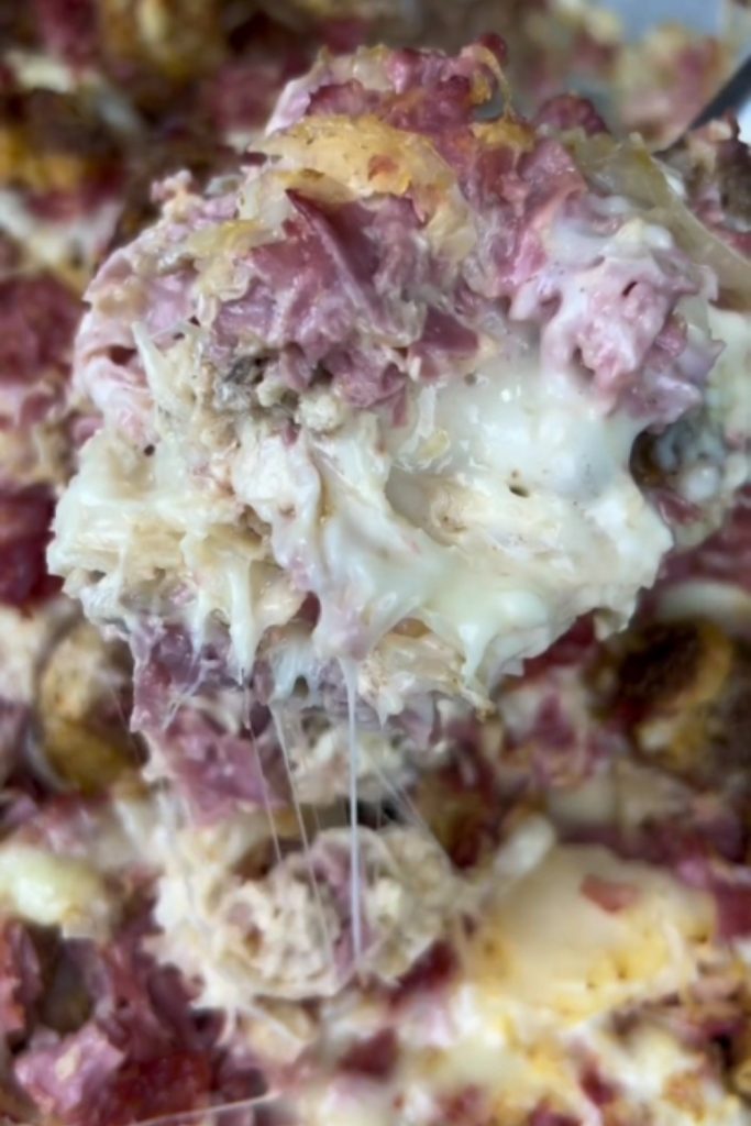 Reuben Casserole with melted cheese and corned beef.