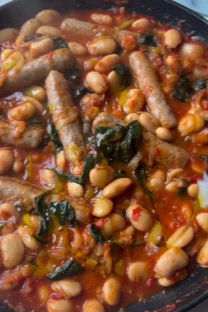 Slow Cooker Sausage and Butter Bean Casserole with sausages, beans, and spinach.