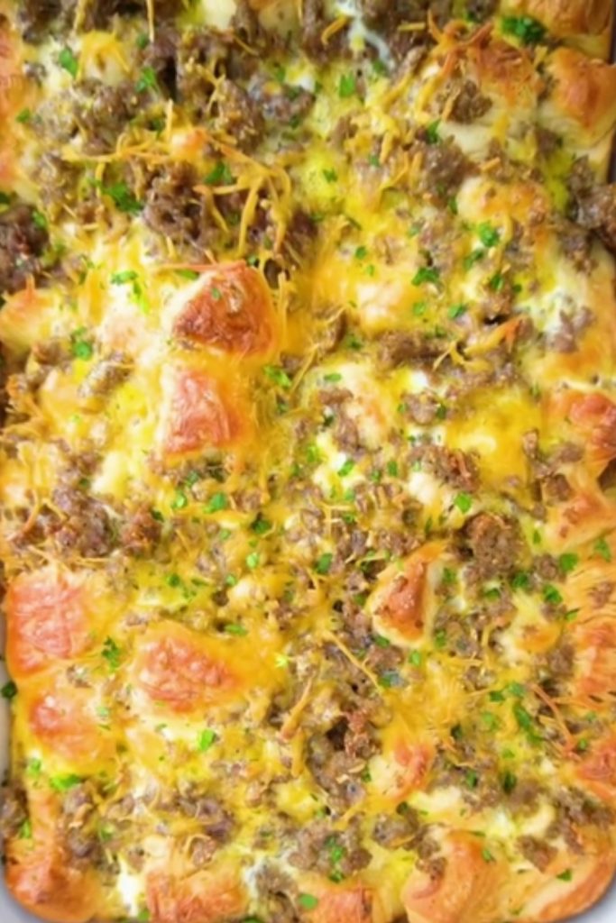 Slow Cooker Biscuit Breakfast Casserole with crispy cheese and sausage.