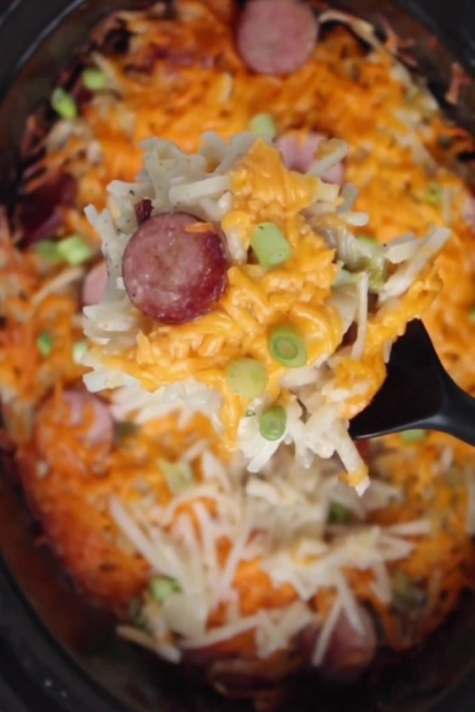 Slow Cooker Cheesy Kielbasa Hashbrown Casserole with green onions.