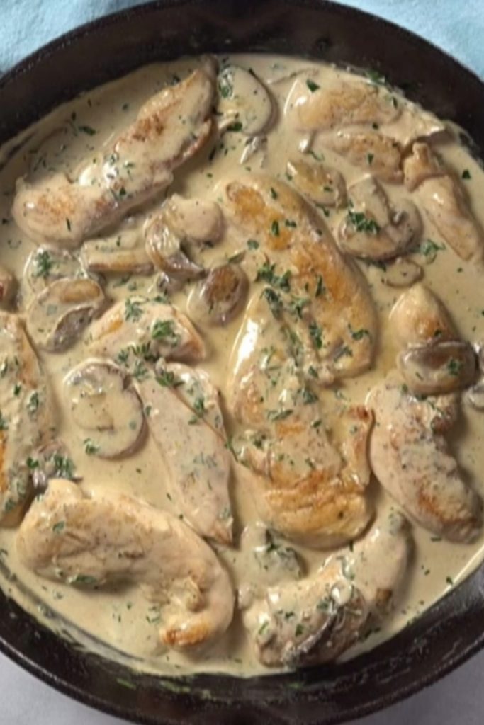 Slow Cooker Chicken Mushroom Casserole with creamy sauce and herbs.