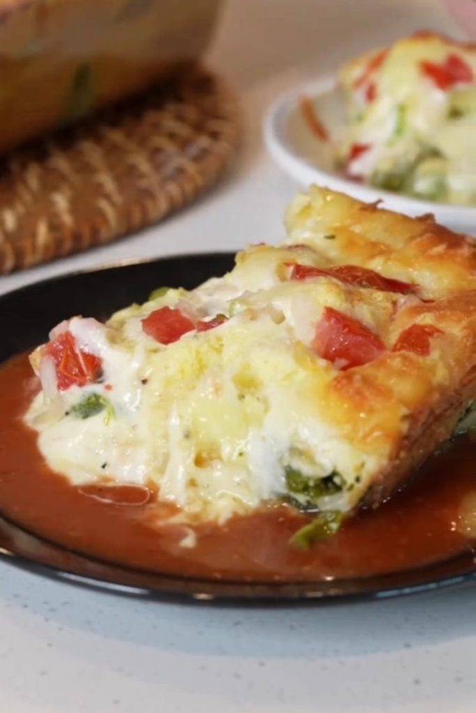 Slow Cooker Chile Rellenos Casserole served on a black plate.