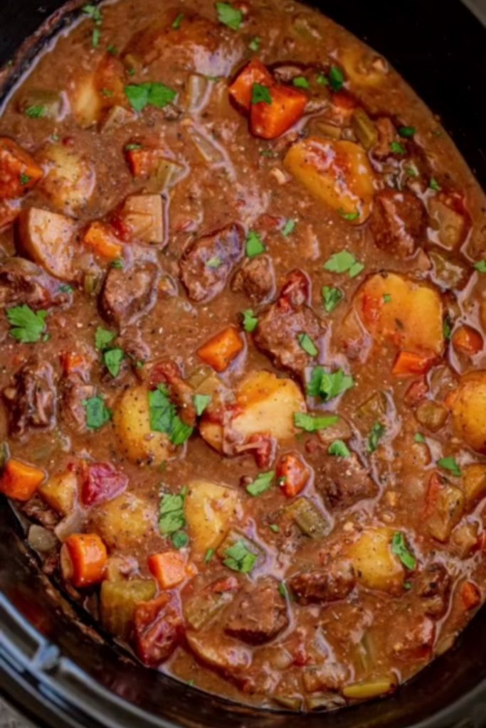 Venison Slow Cooker Stew with carrots, potatoes, and parsley.