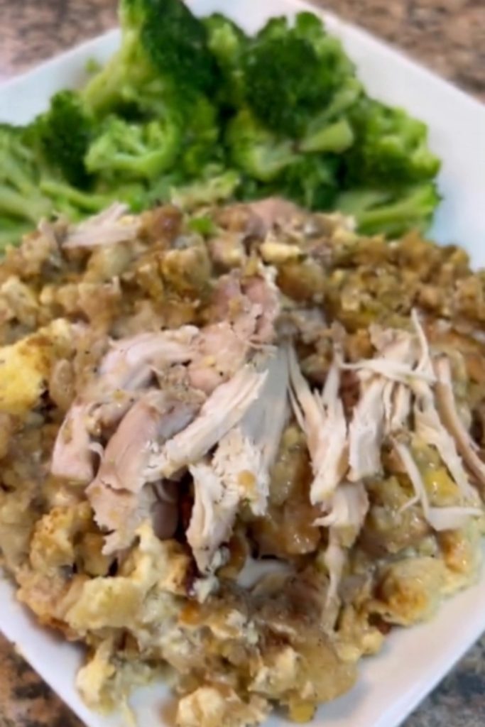 Plate of slow cooker chicken and stuffing served with broccoli.